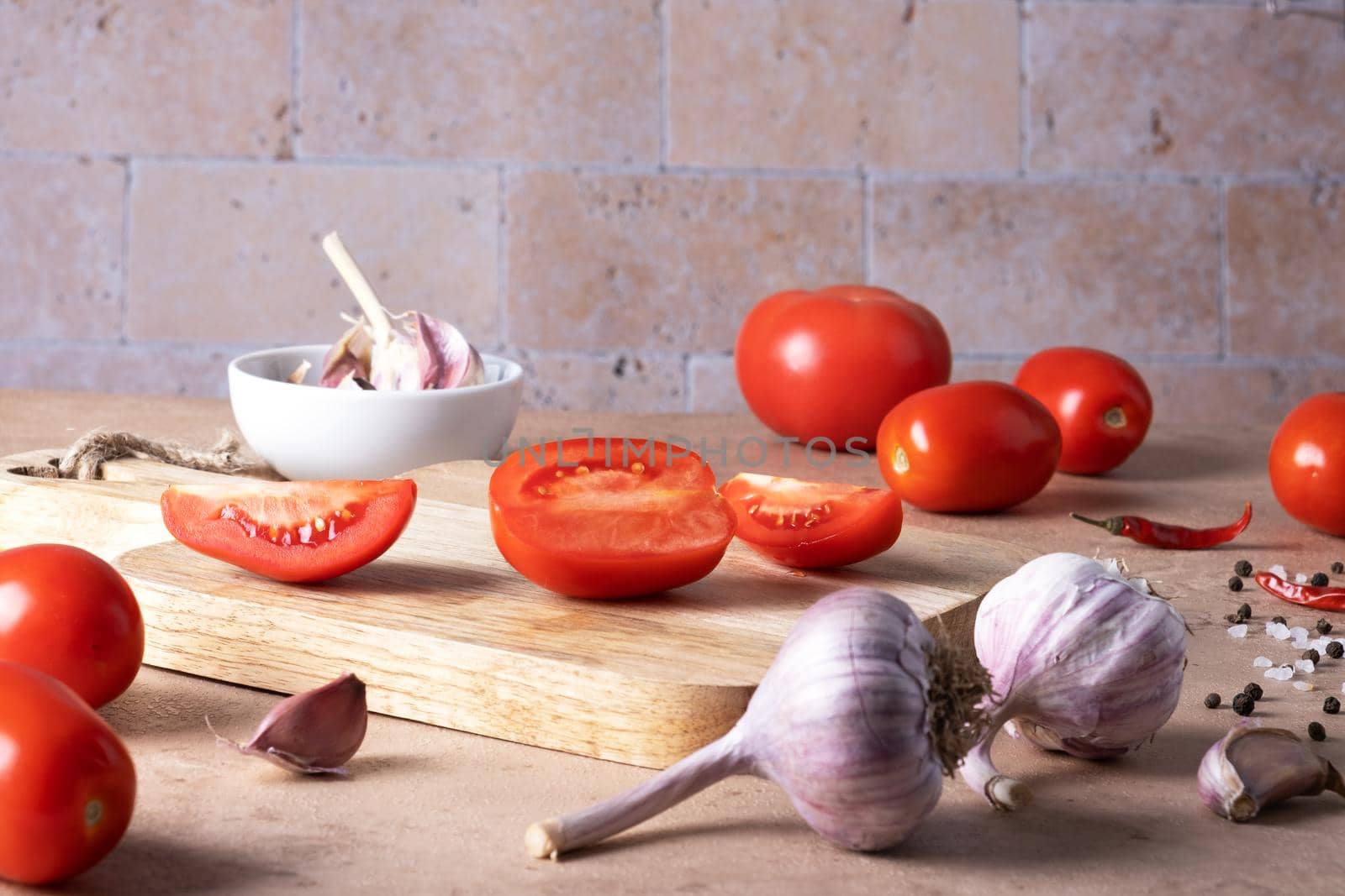 Ingredients for making homemade tomato sauce or canned tomatoes. Selective focus.