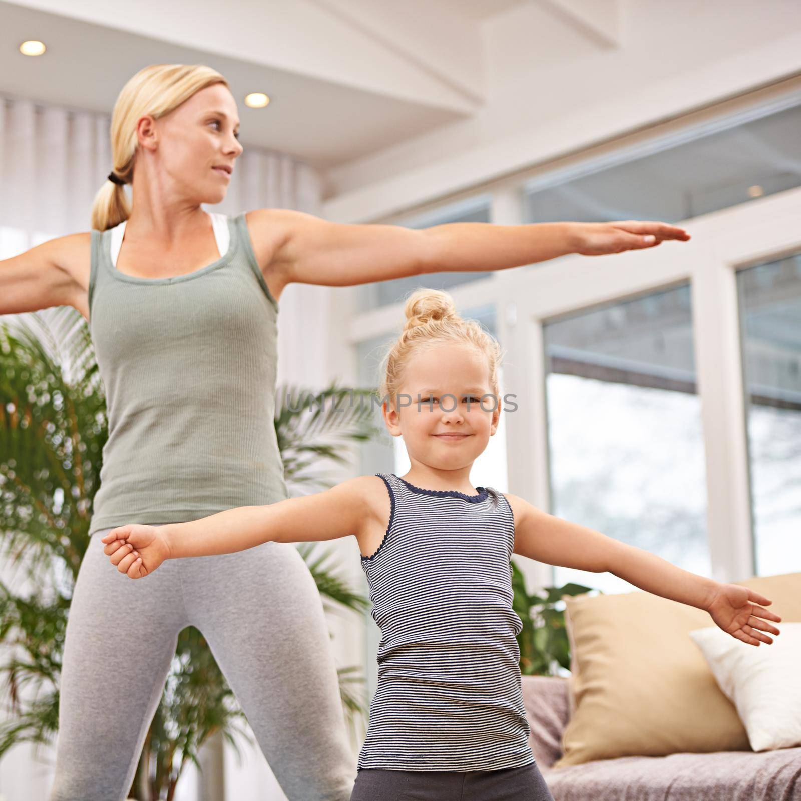 Yoga has no age restriction. Full length shot of a mother and daughter doing yoga together