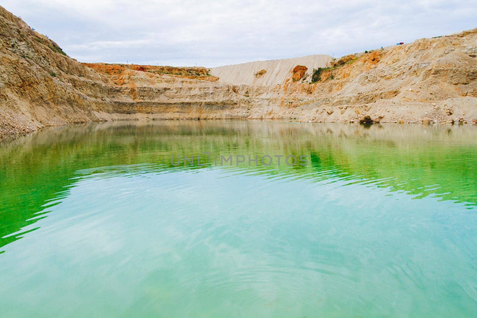 Lake formation in an old abandoned quarry. Termination of mining operations. by Verrone
