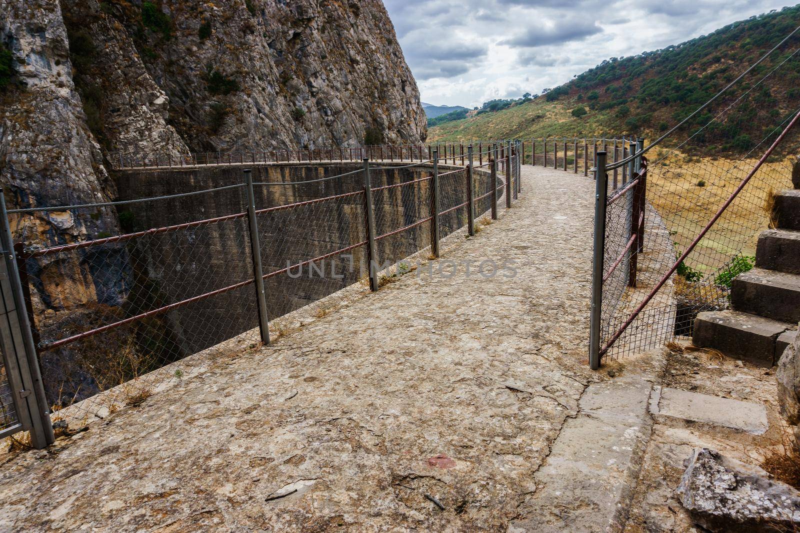 view of the upper part of a dam over a swamp by joseantona