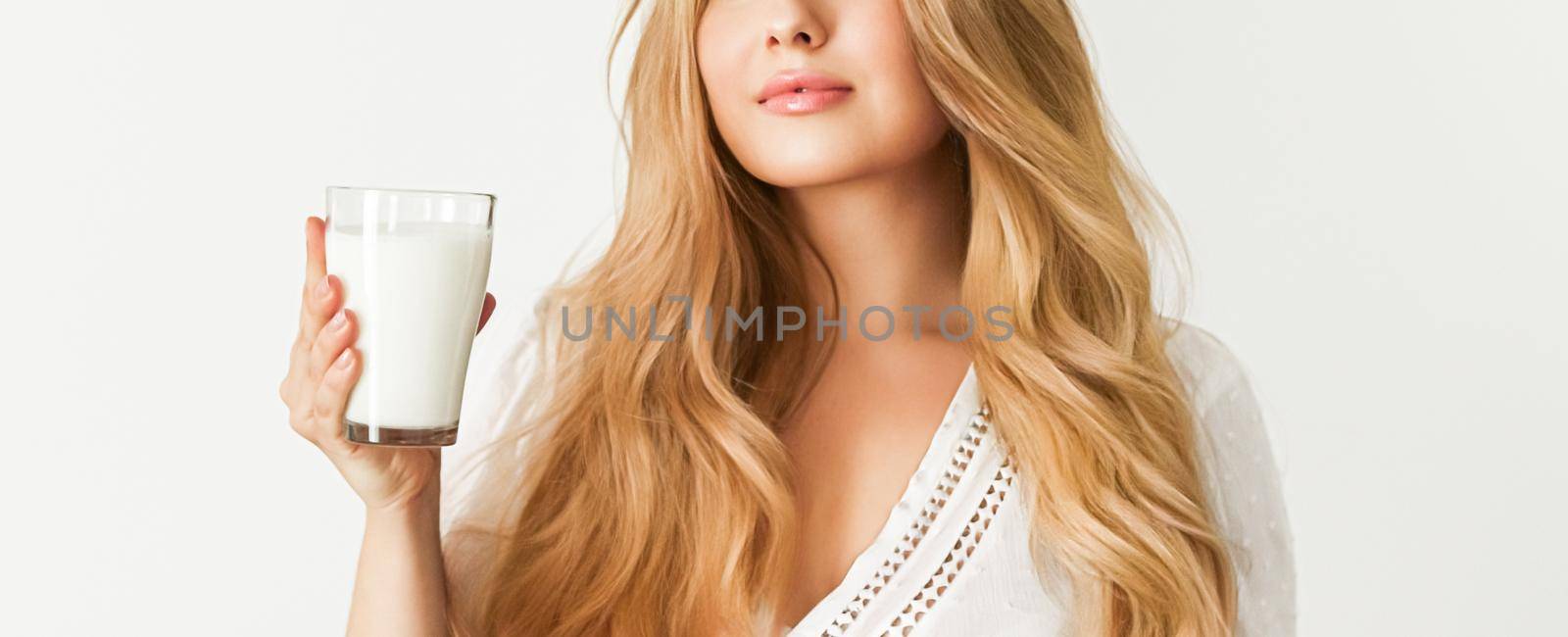 Diet, health and wellness concept, woman holding glass of milk or protein shake cocktail