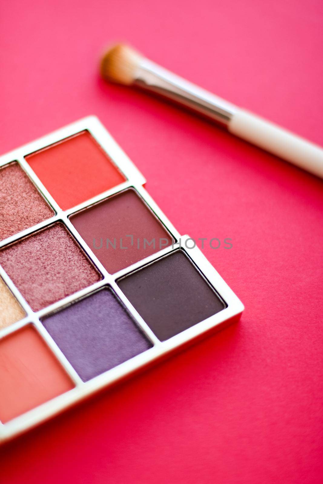 Cosmetic branding, mua and girly concept - Eyeshadow palette and make-up brush on red background, eye shadows cosmetics product for luxury beauty brand promotion and holiday fashion blog design