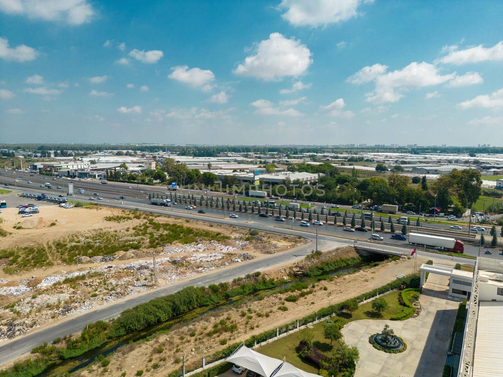 Aerial view of riverside highway on a sunny day