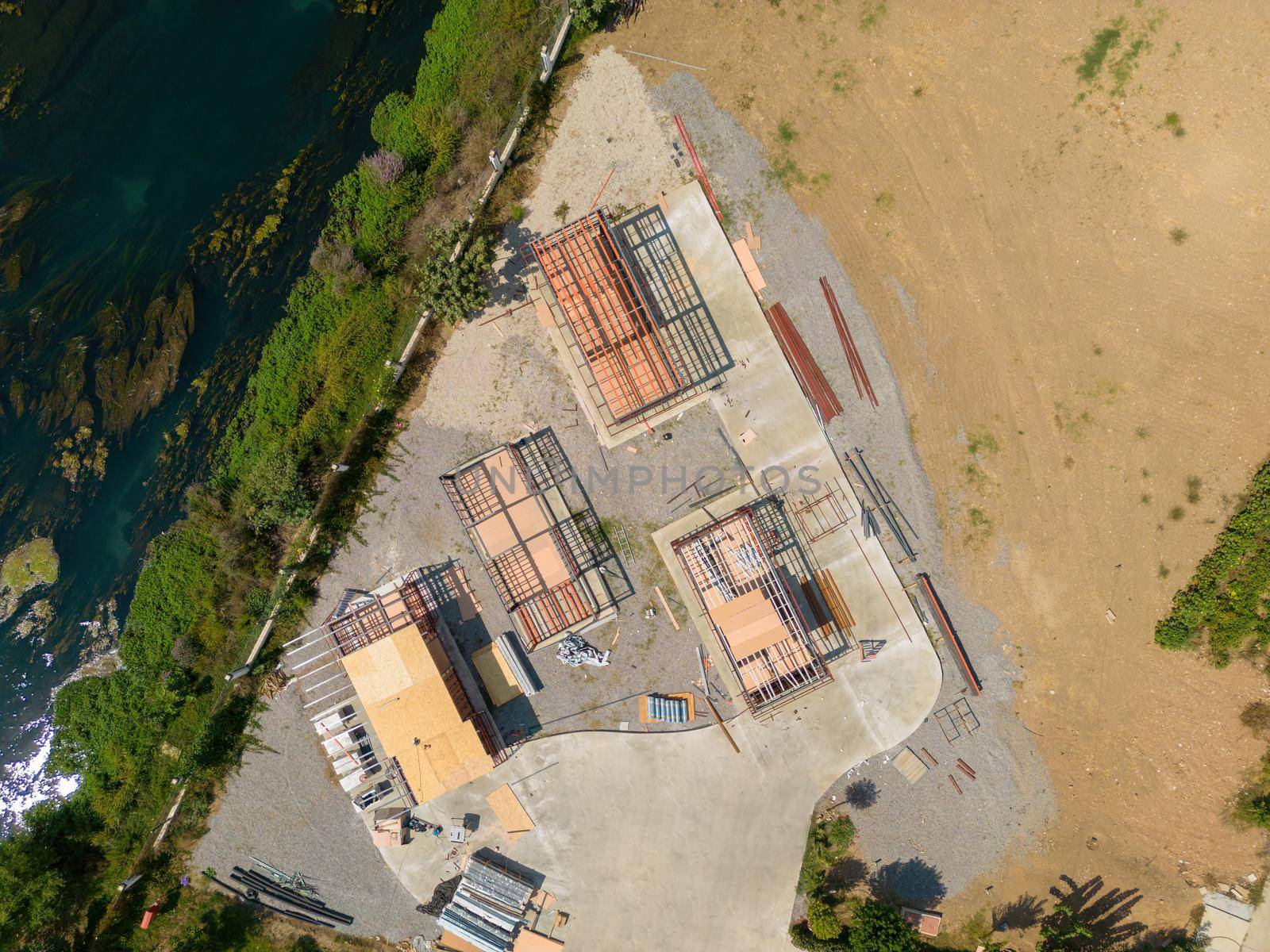 Aerial photo top to down view of tiny houses built with metal profile