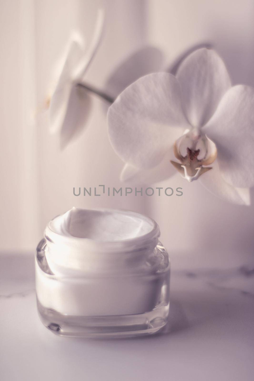 Cosmetic branding, toiletries and spf concept - Face cream moisturizer jar and orchid flower, moisturizing skin care lotion and lifting emulsion, anti-age cosmetics for luxury beauty skincare brand