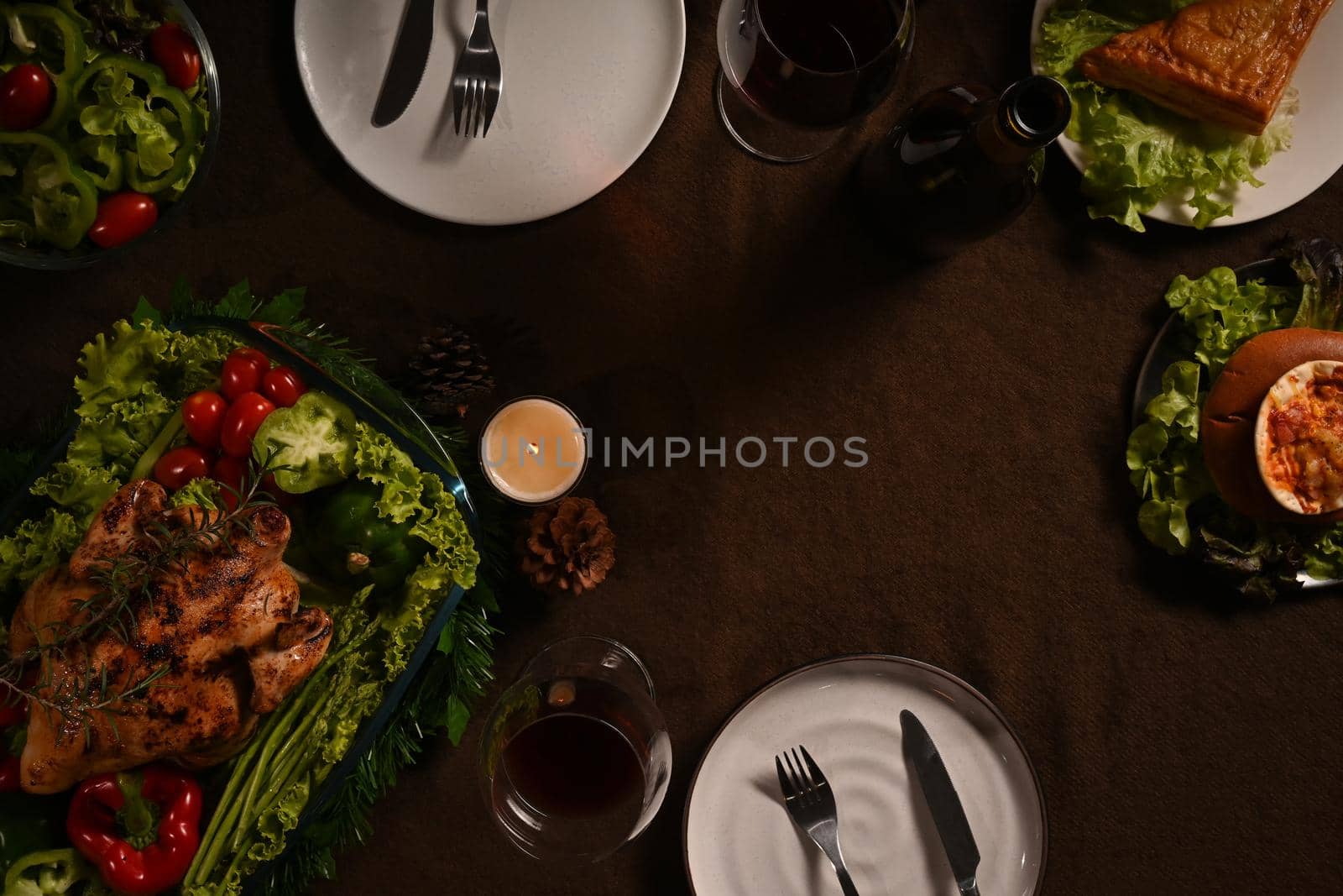 Traditional Thanksgiving dinner meal with roasted turkey and all sides dishes on wooden table. Traditional autumn food concept.