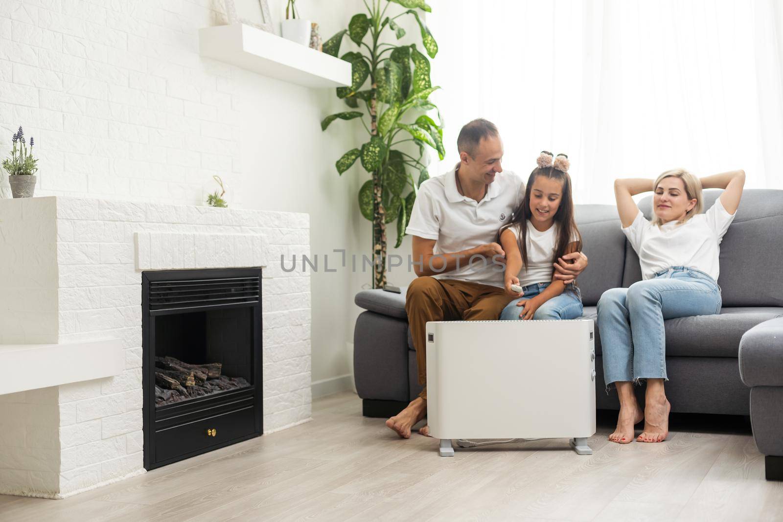 Modern electric heater on floor at home.