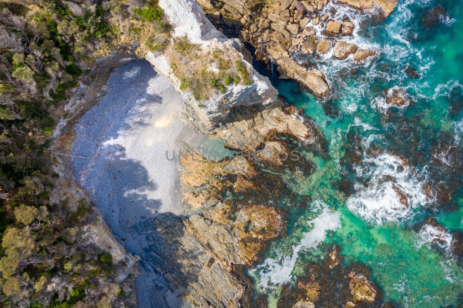Aerial coastal views of rocky inlets, caves and hidden beaches