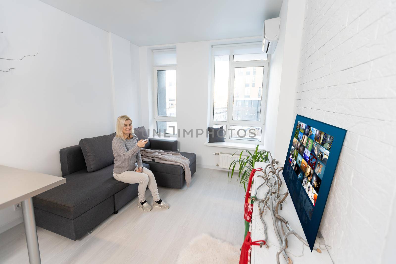 Happy woman watching TV, Christmas