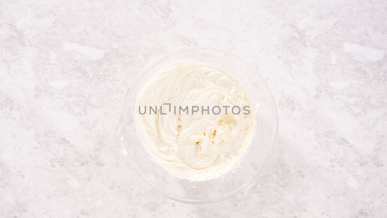 Flat lay. Step by step. Preparing store-bought buttercream frosting to make unicorn rainbow chocolate cupcakes.
