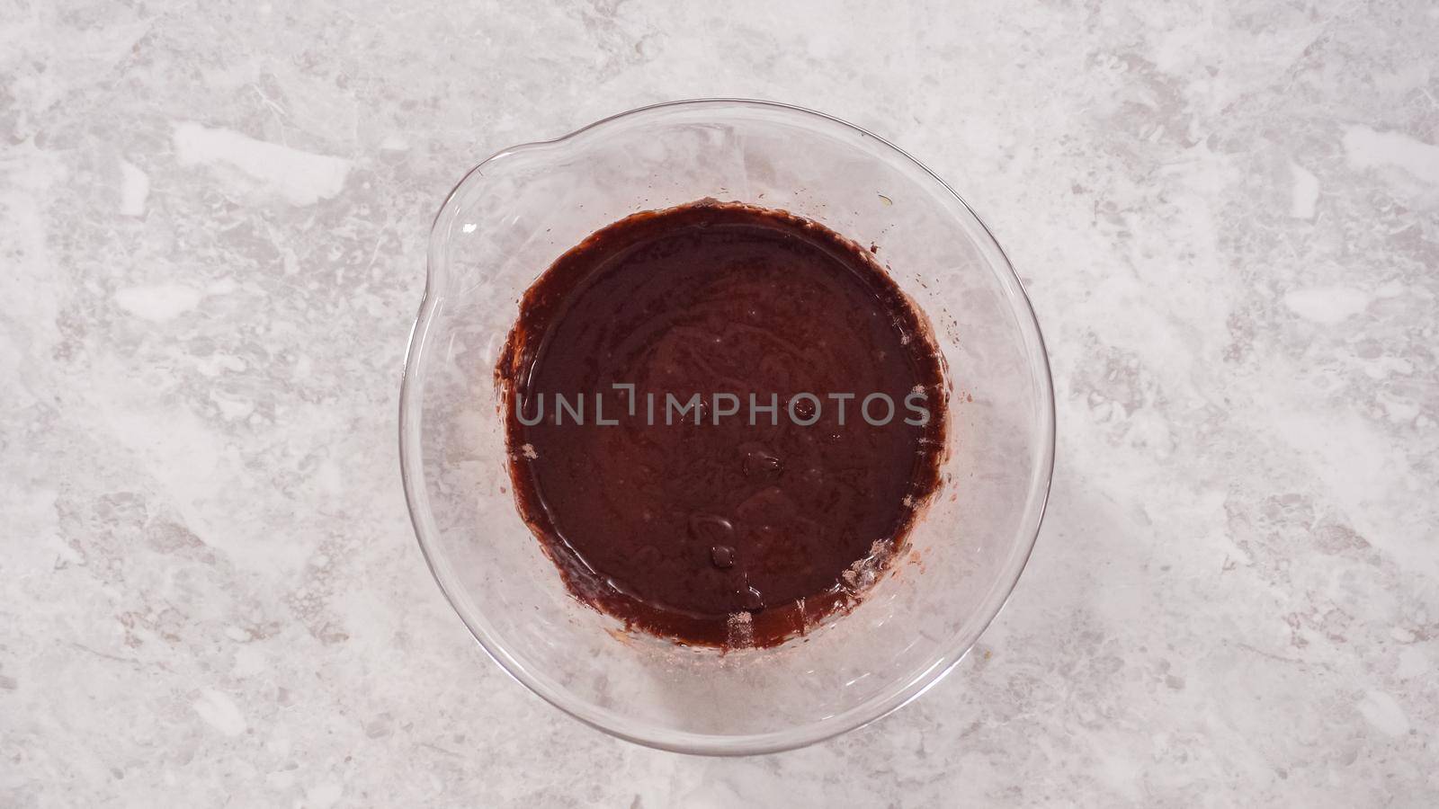 Flat lay. Step by step. Mixing ingredients to bake unicorn rainbow chocolate cupcakes.