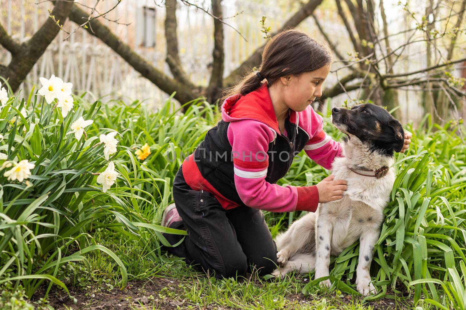 happy child girl with her dog by Andelov13