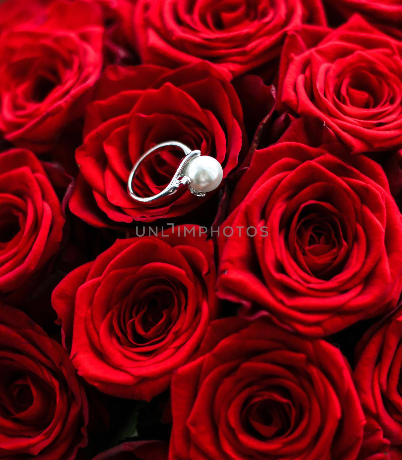 Beautiful white gold pearl ring and bouquet of red roses, luxury jewelry love gift on Valentines Day and romantic holidays by Anneleven