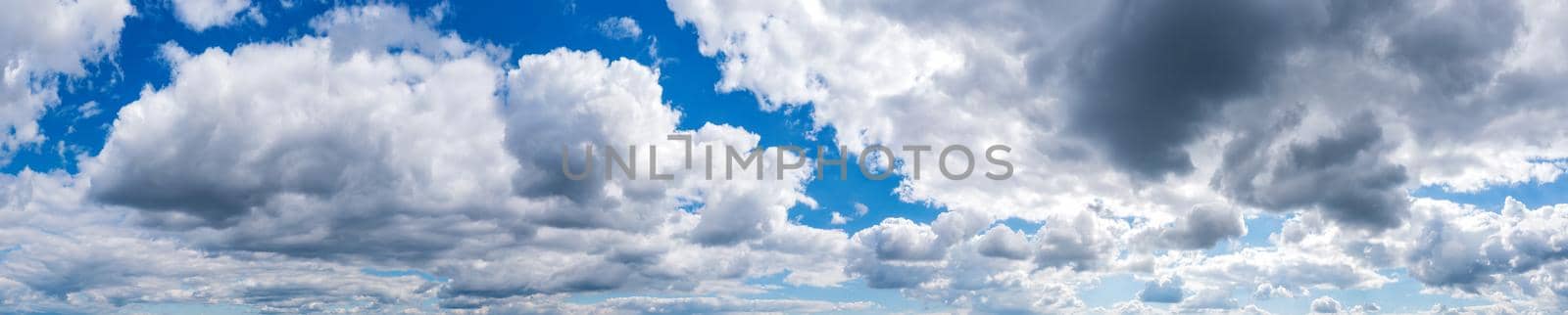 Panoramic view of blue sky with fluffy clouds  by EdVal