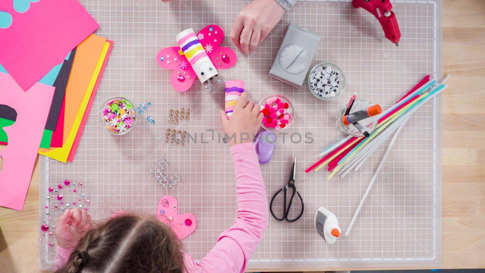 Flat lay. Kids papercraft. Making paper bugs out of the empty toilet paper rolls and construction paper.