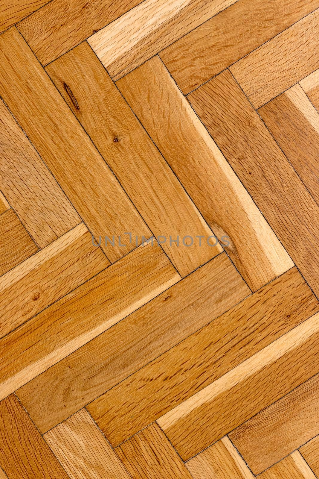 old parquet flooring, parquet board lined with Herringbone pattern