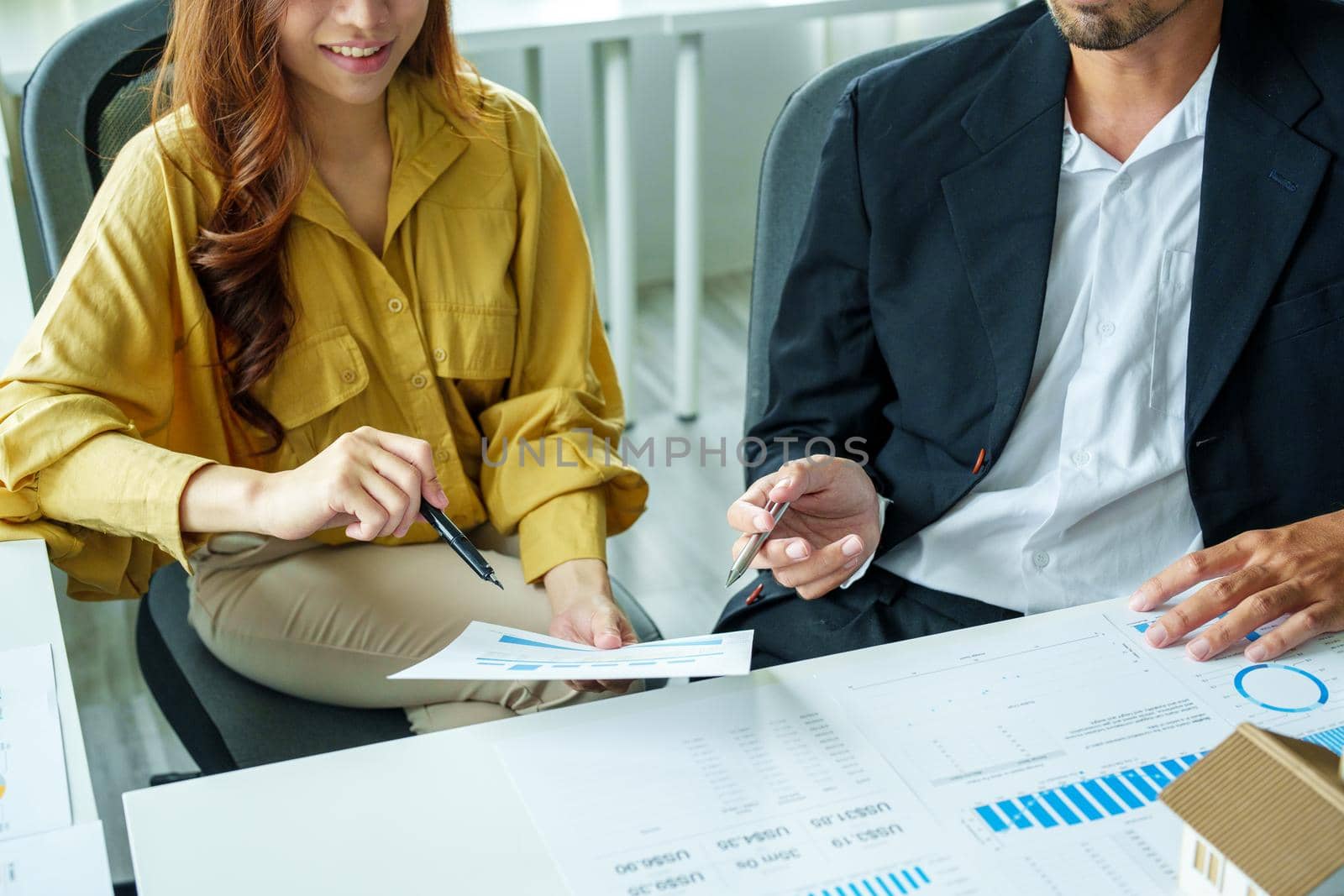 Portrait of a female business owner and partner company meeting to collaborate to invest in imported goods, plan to increase marketing profits using budget documents and working calculator.