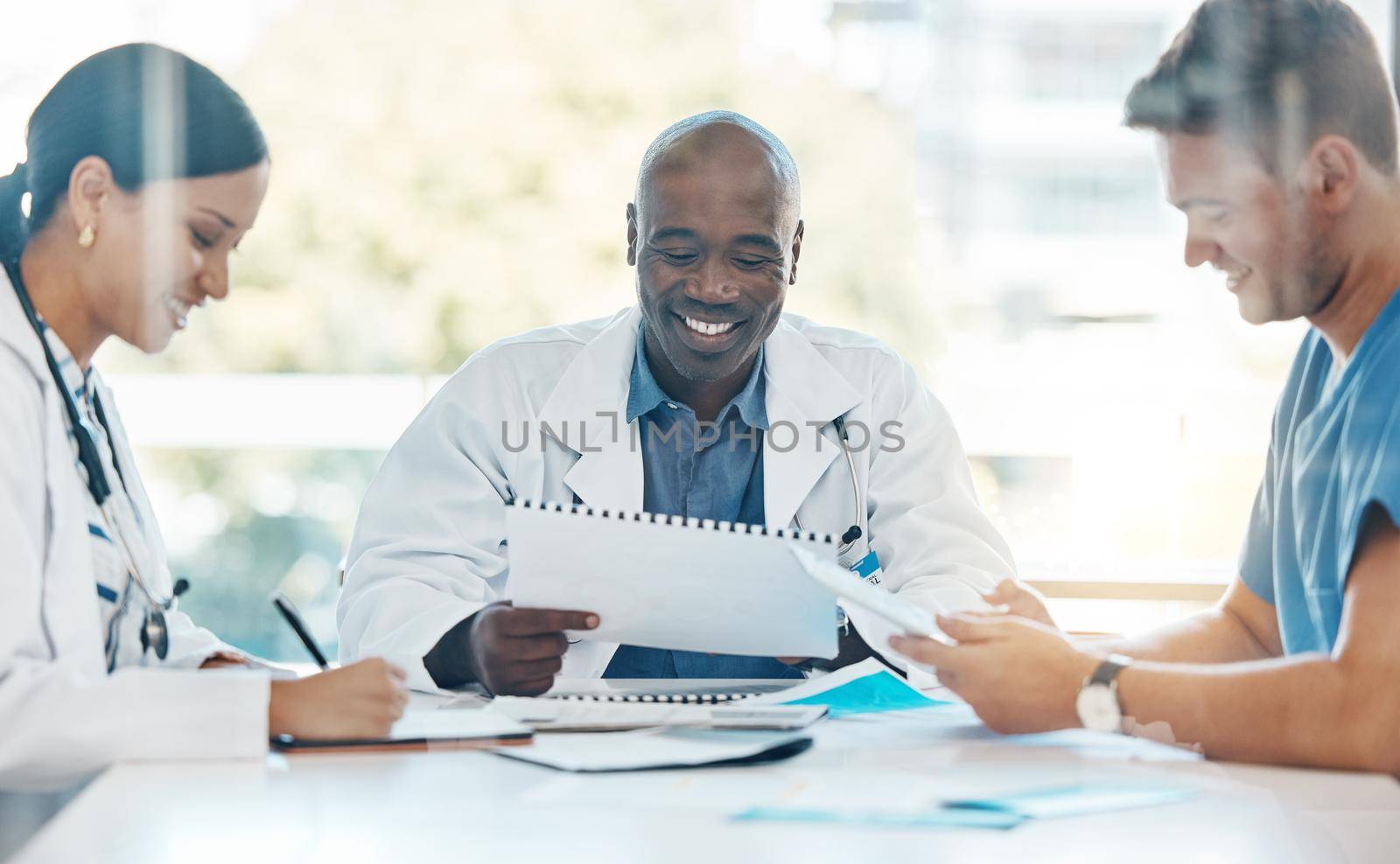 Doctor team conversation about medical document in a meeting together at work. Healthcare workers talking while planning, communication and strategy in a hospital office or boardroom with teamwork.