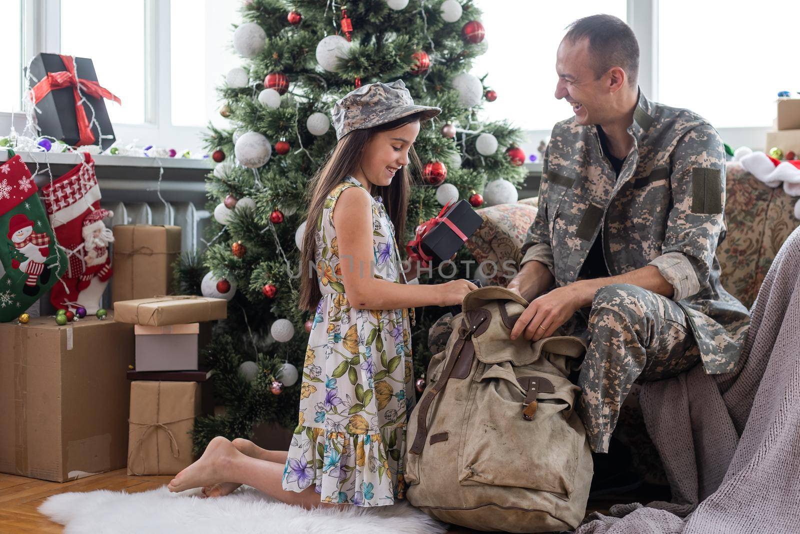 military with daughter at christmas.