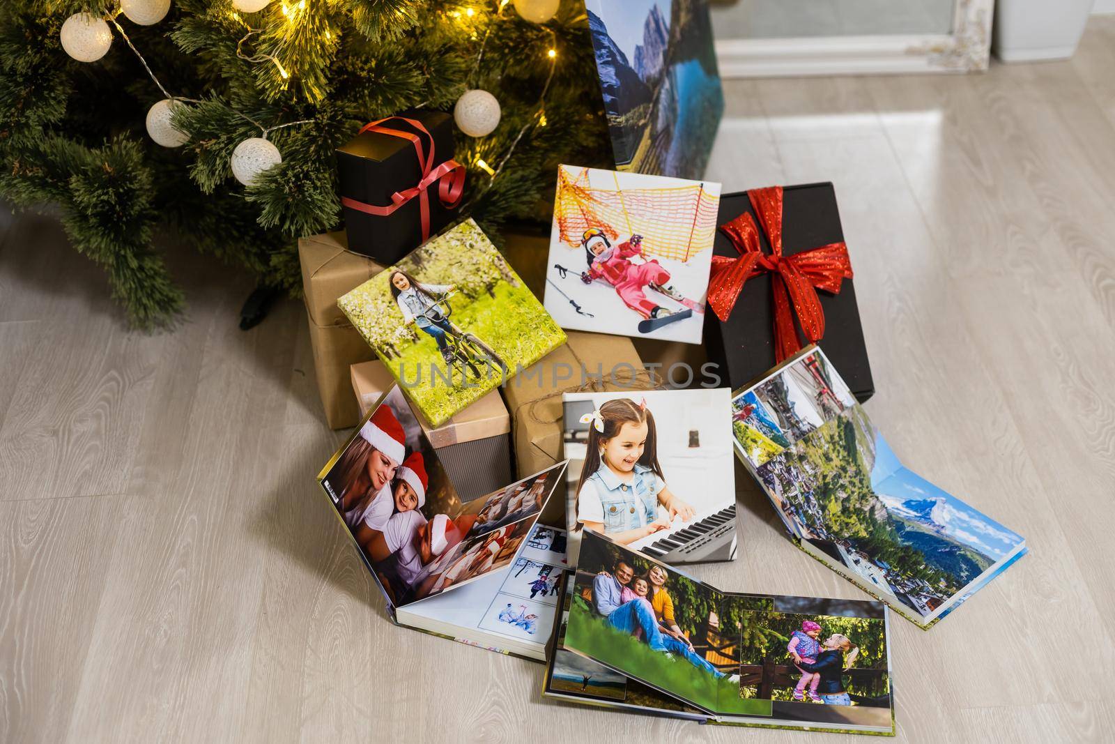 photobooks near the New Year tree, colored as a gift for the holiday
