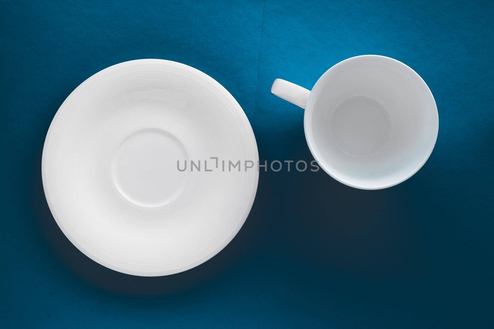Kitchen, table decor and drinks menu concept - White tableware crockery set, empty cup on blue flatlay background