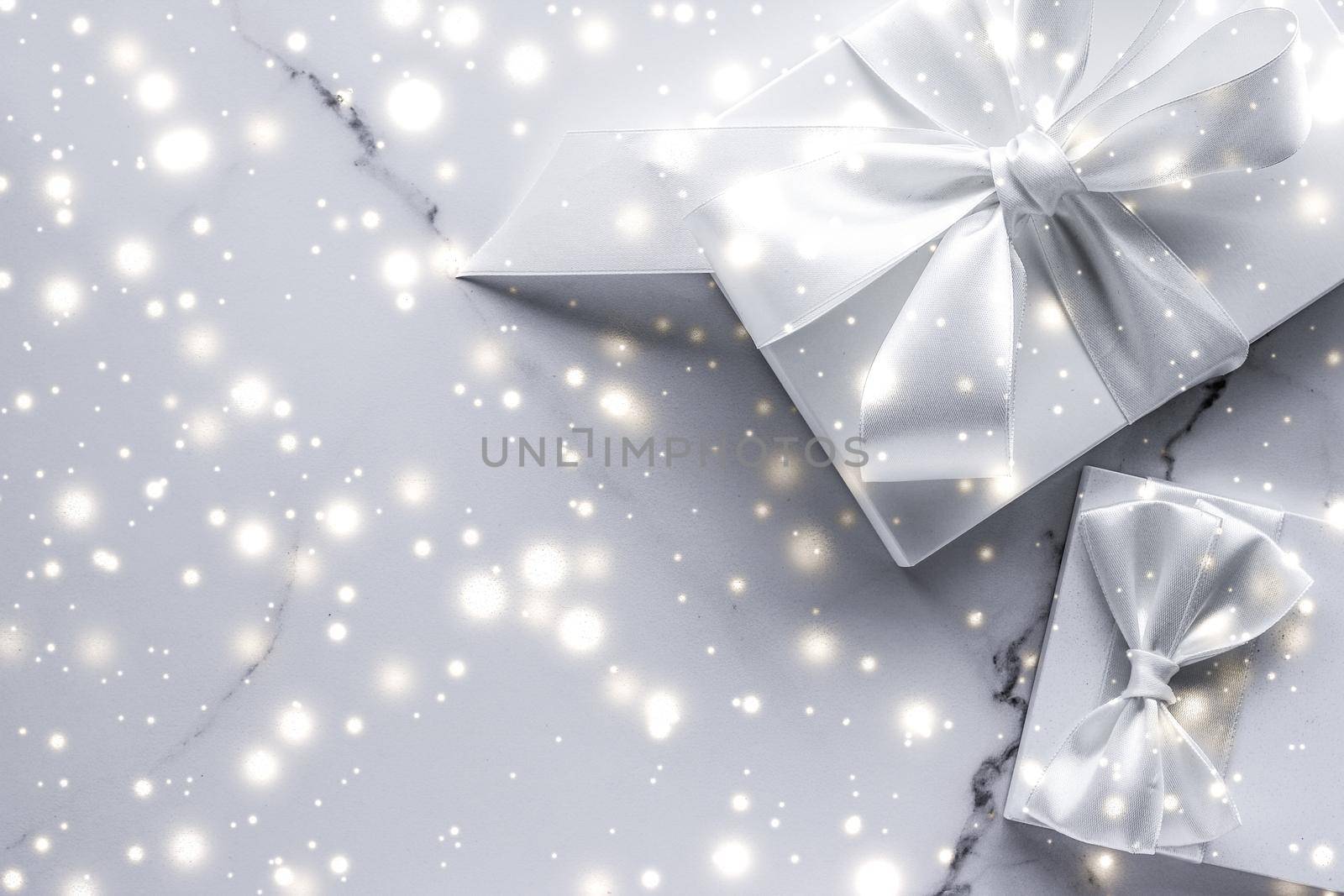 Luxury holiday gifts with white silk bow and ribbons on marble background, Christmas time surprise by Anneleven