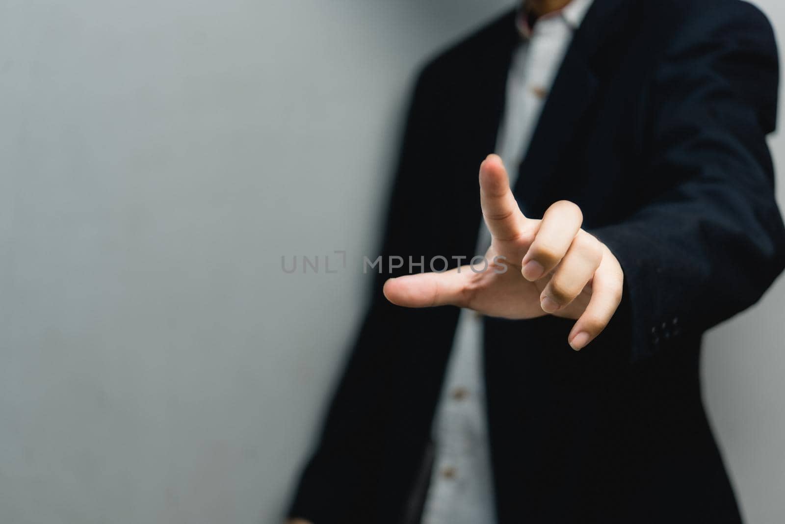 Businessman pressing button on virtual screen.copy Space for text.
