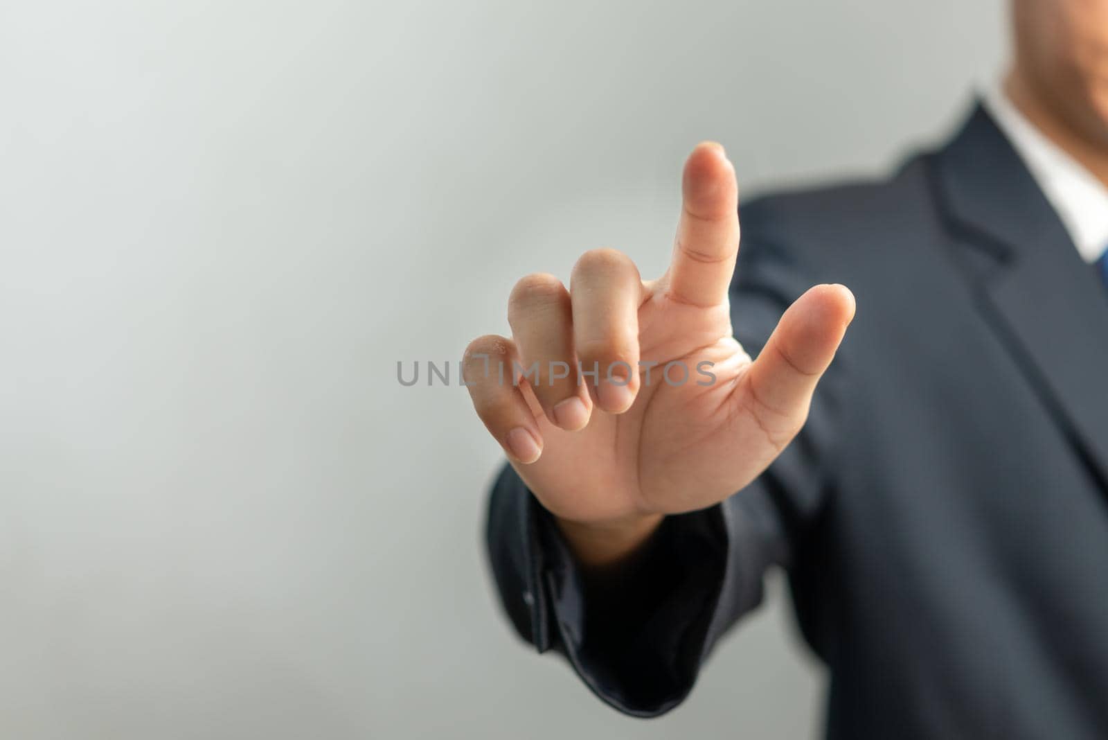 Businessman pressing button on virtual screen.copy Space for text.