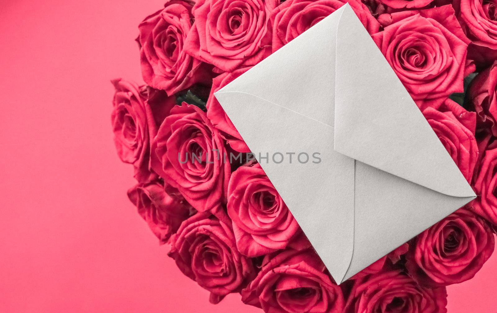 Holidays gift, floral present and happy relationship concept - Love letter and flowers delivery on Valentines Day, luxury bouquet of roses and card on pink background for romantic holiday design