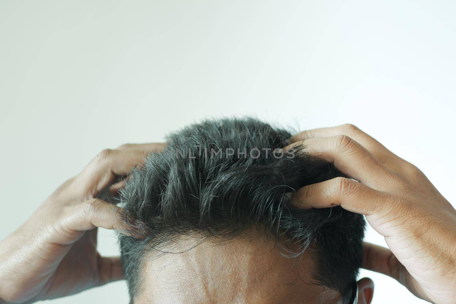 men Scratching Head Against white background