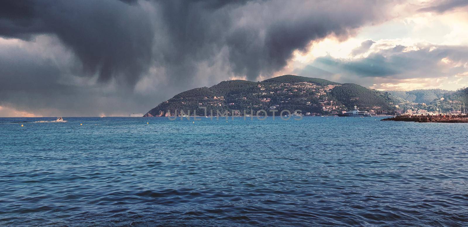 Storm clouds and island, storm Passing over the ocean, dramatic clouds. High quality photo