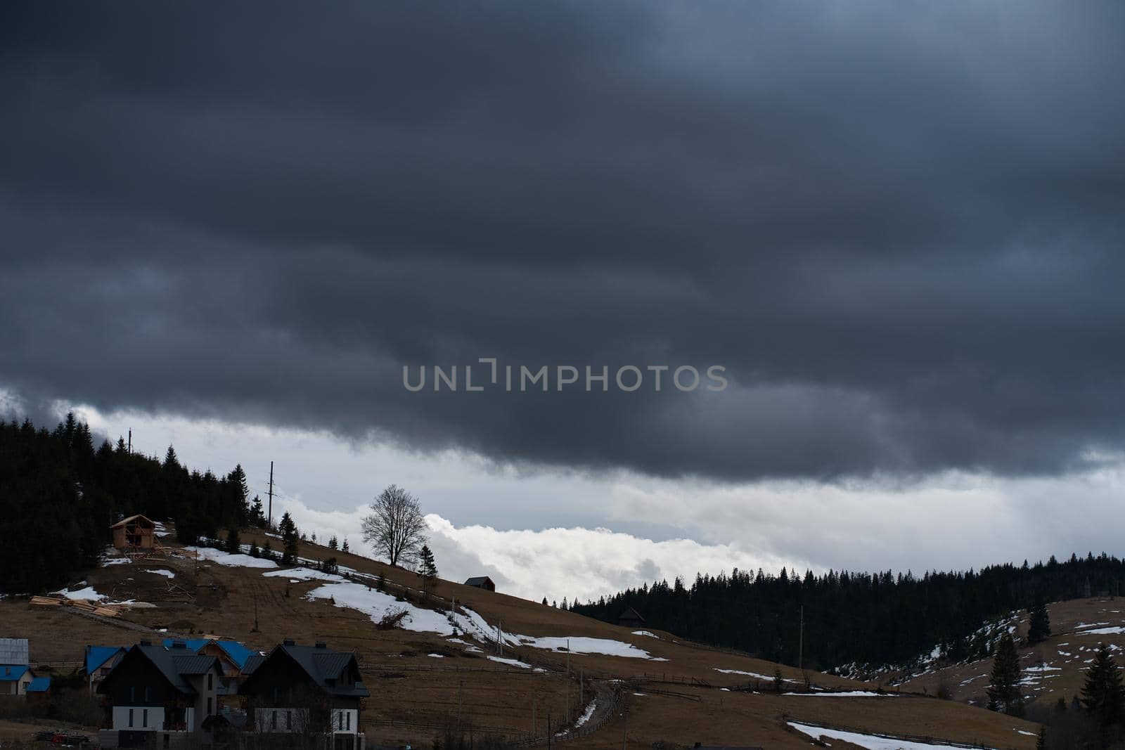 Ukrainian karpaty mountains winter landscape. Village among mountains.