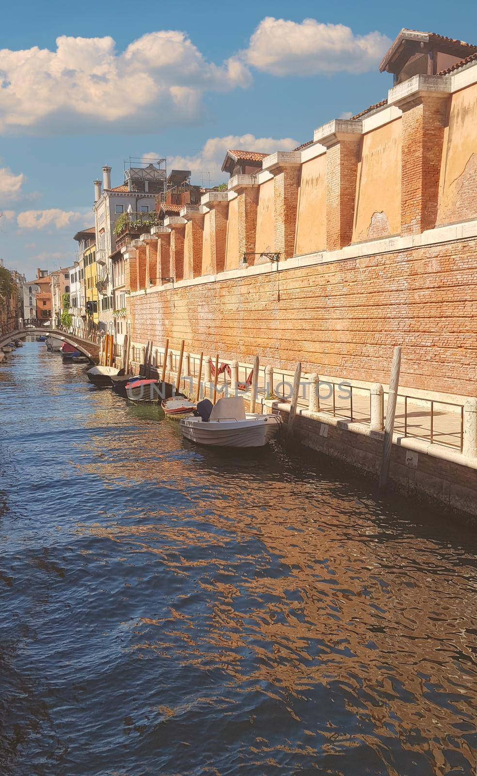 Venice narrow street with boats and water. High quality photo