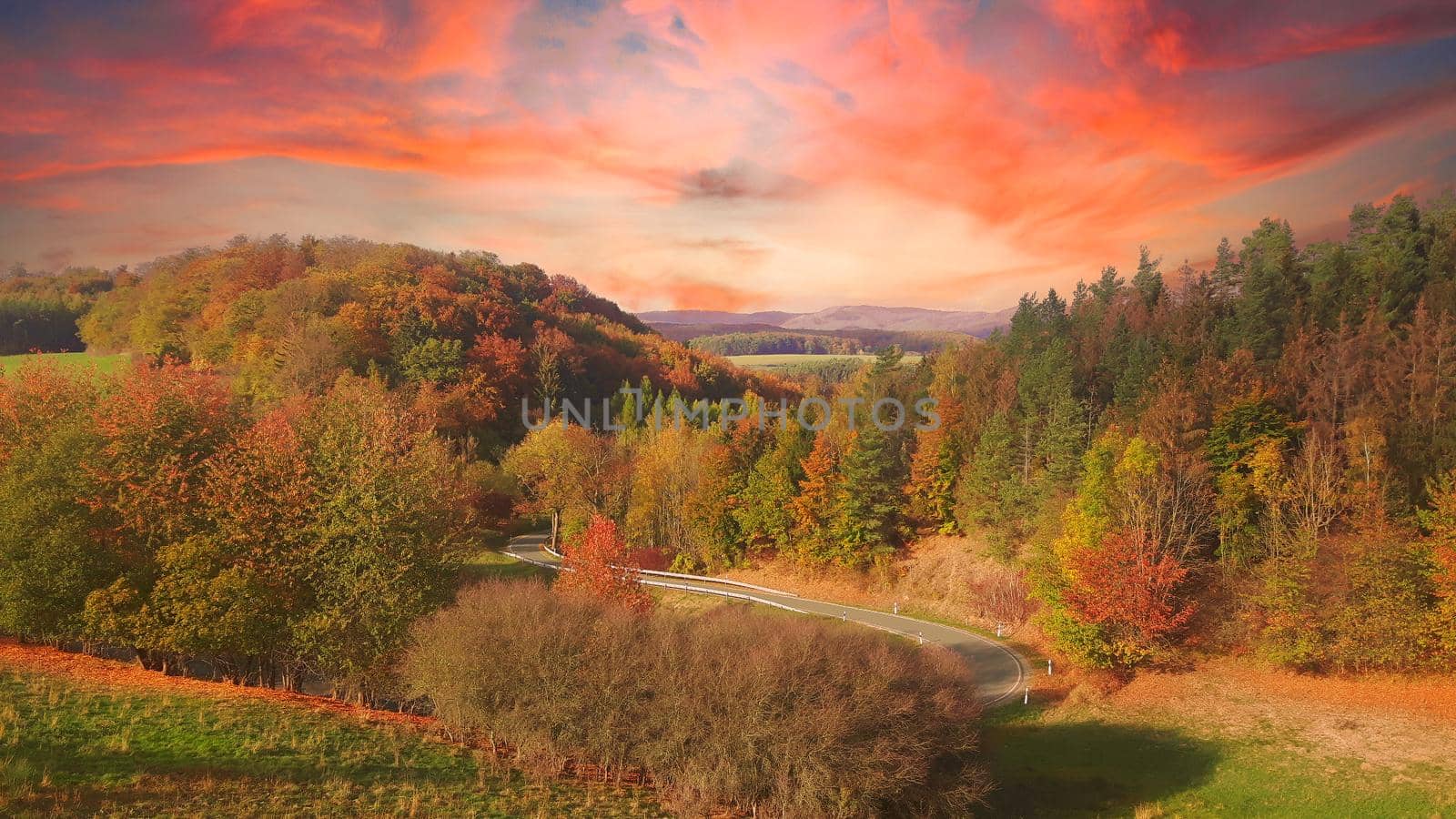 Colorful autumn scene in the mountains at sunset by banate