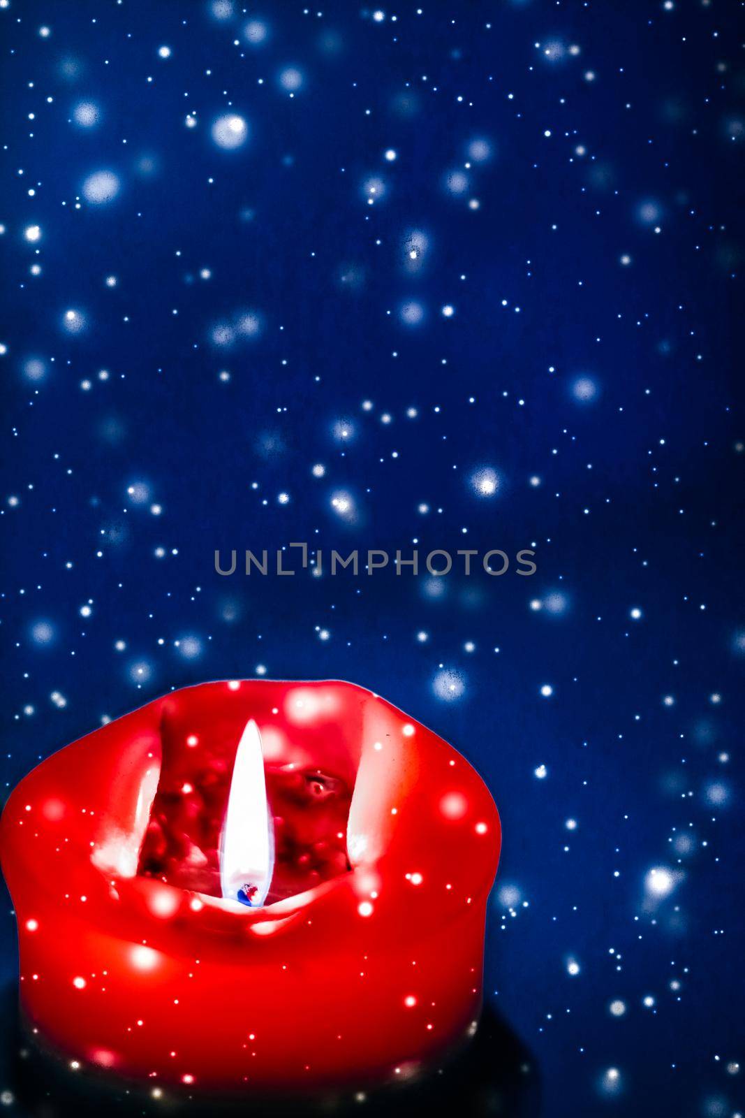 Happy holidays, greeting card and winter season concept - Red holiday candle on blue sparkling snowing background, luxury branding design for Christmas, New Years Eve and Valentines Day