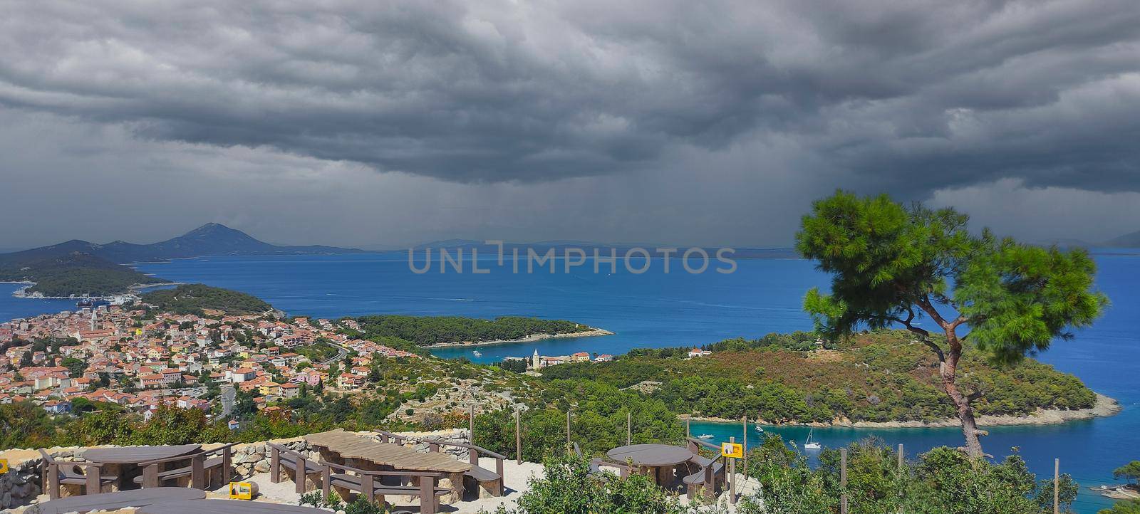 city on the island by the sea with dramatic clouds. High quality photo