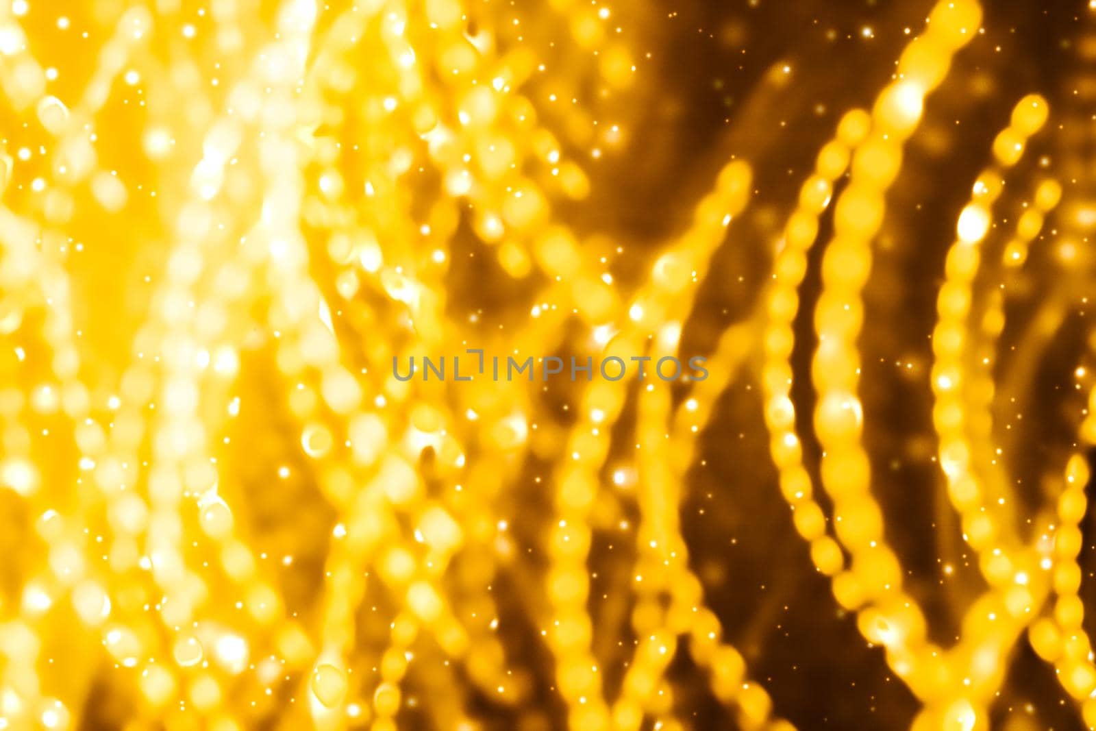 Golden Christmas lights, New Years Eve fireworks and abstract texture concept - Glamorous gold shiny glow and glitter, luxury holiday background