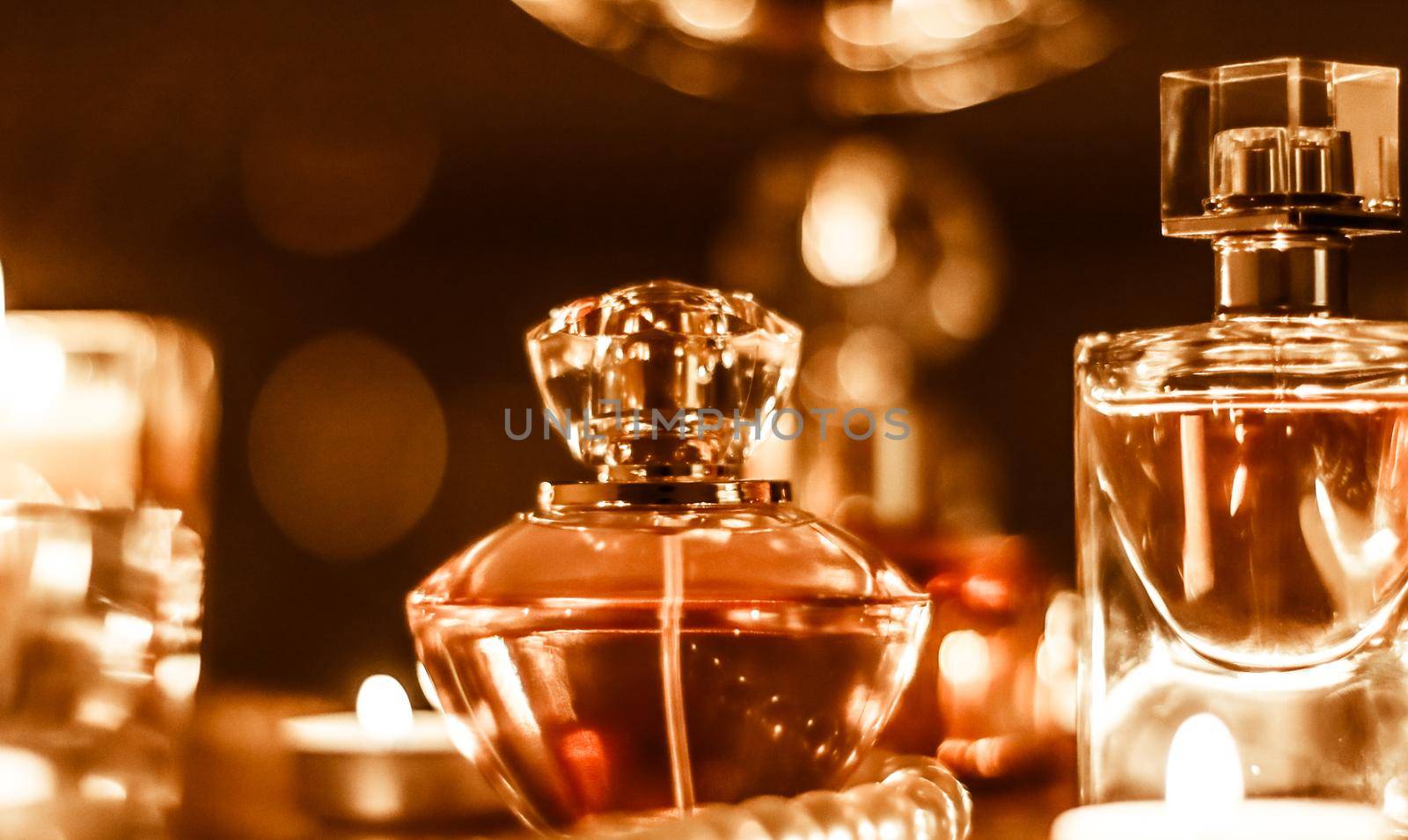 Perfumery, cosmetics branding and luxe concept - Perfume bottle and vintage fragrance on glamour vanity table at night, pearls jewellery and eau de parfum as holiday gift, luxury beauty brand present