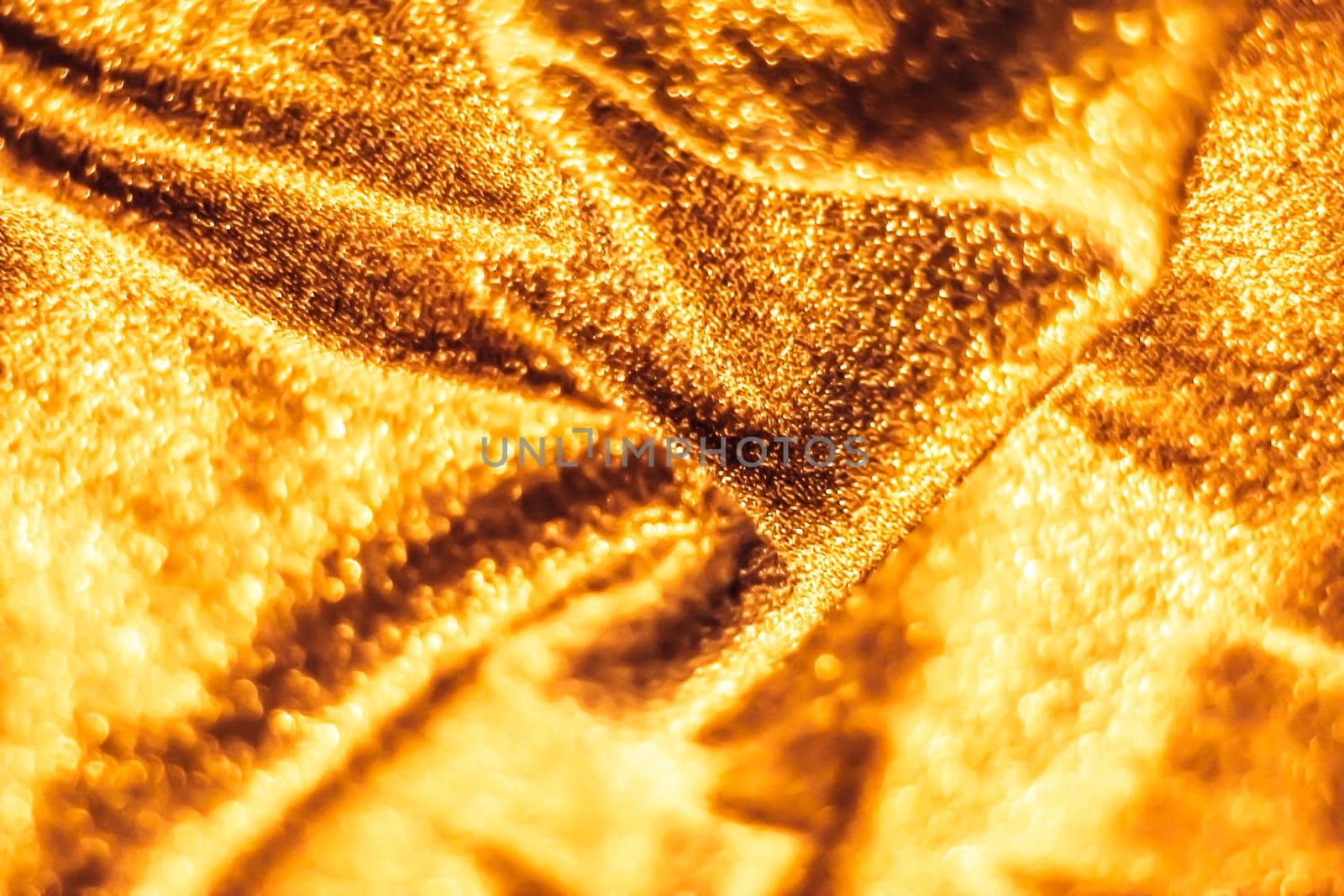 Luxe glowing texture, night club branding and New Years party concept - Golden holiday sparkling glitter abstract background, luxury shiny fabric material for glamour design and festive invitation