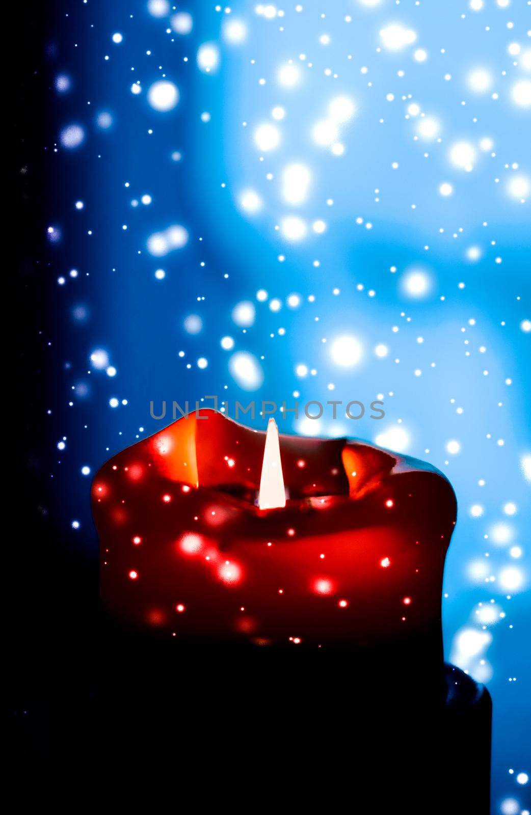 Happy holidays, greeting card and winter season concept - Red holiday candle on dark sparkling snowing background, luxury branding design for Christmas, New Years Eve and Valentines Day