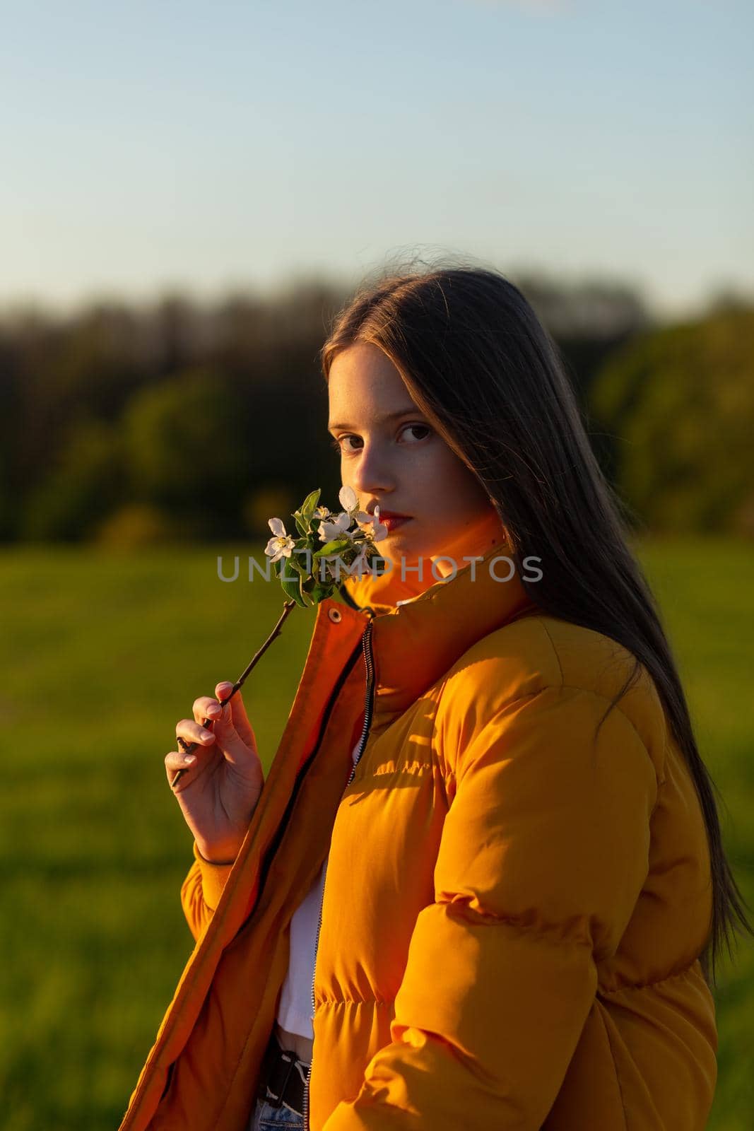 Portrait of a beautiful happy teenage girl outdoors in spring. by BY-_-BY