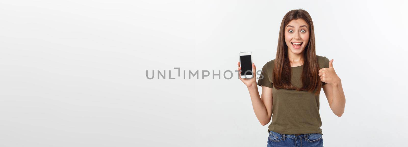 Girl Holding Smart Phone - Beautiful smiling girl holding a smart phone.