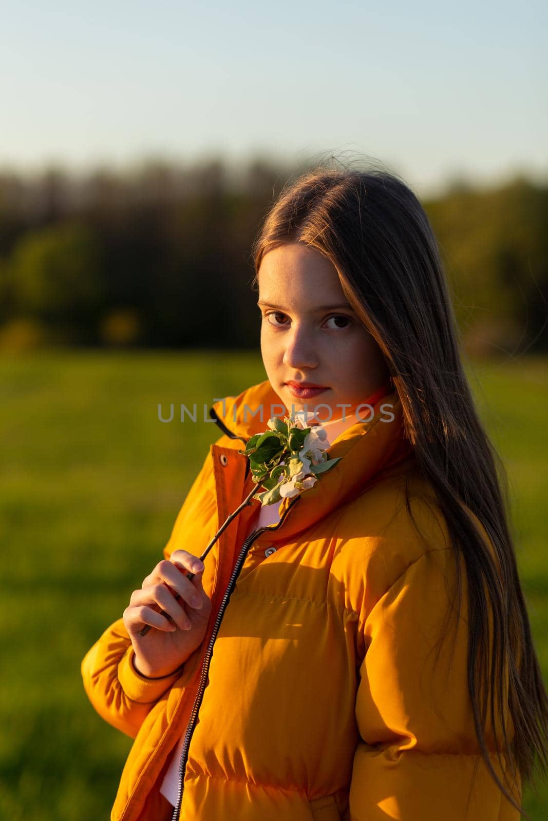 Portrait of a beautiful happy teenage girl outdoors in spring. by BY-_-BY