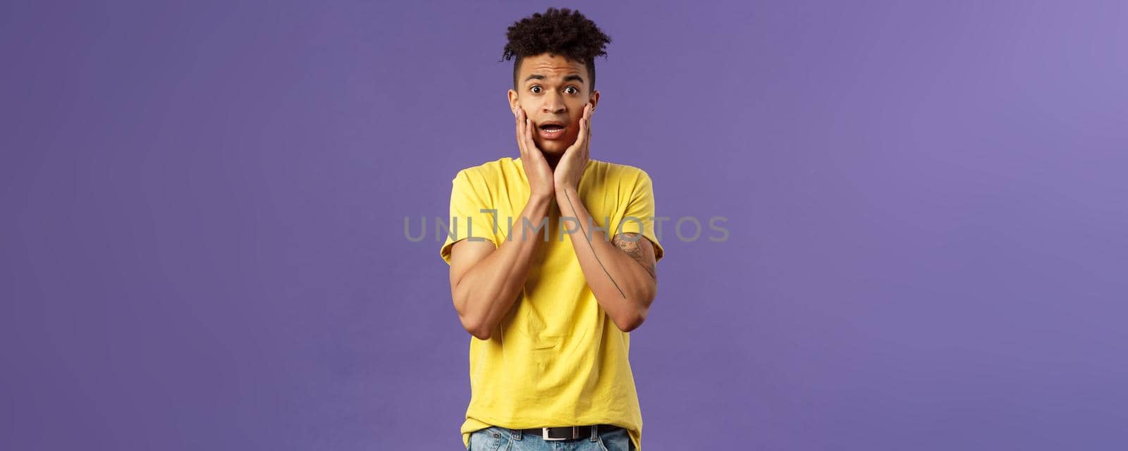 Oh no what do. Portrait of worried, anxious panicking young man feel concerned and confused, hold face and gasping anxious, staring camera alarmed, standing purple background by Benzoix