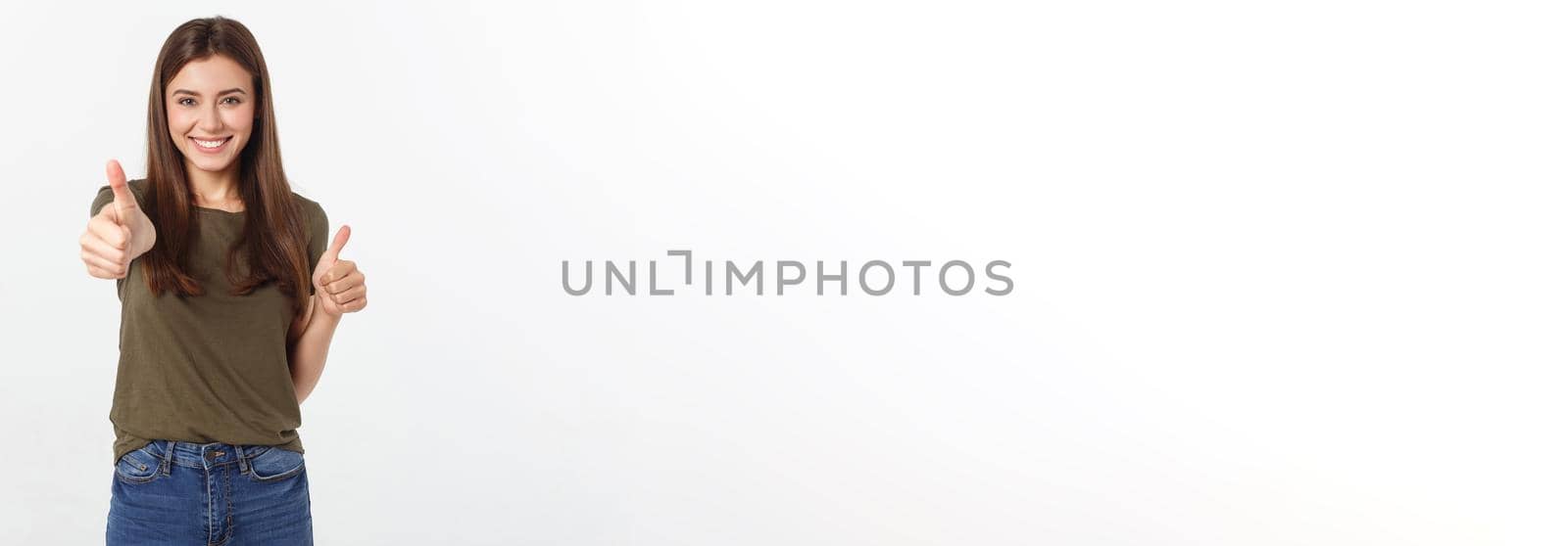 Closeup portrait of a beautiful young woman showing thumbs up sign. Isolate over white background