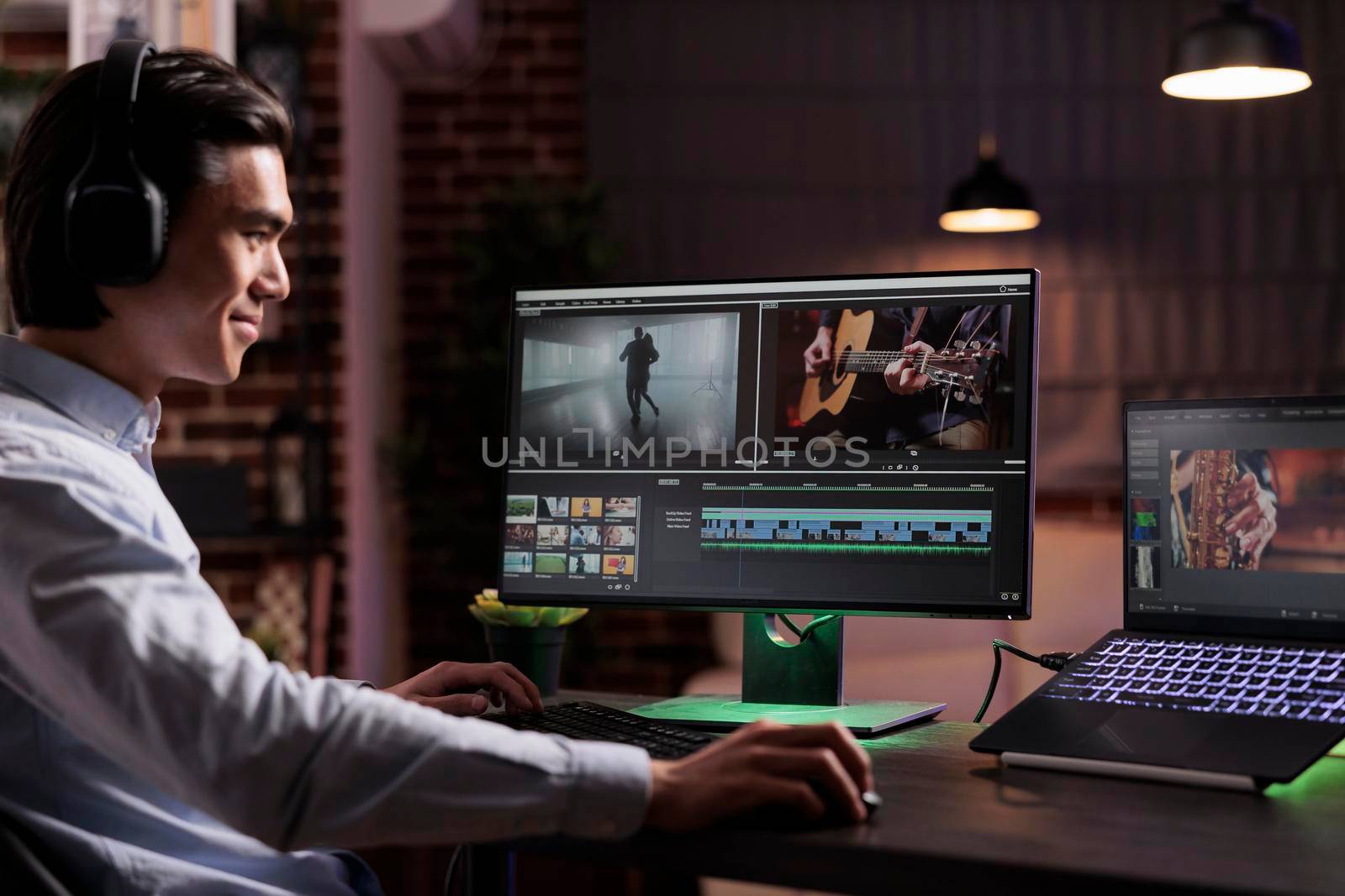 Male videographer editing movie footage by DCStudio