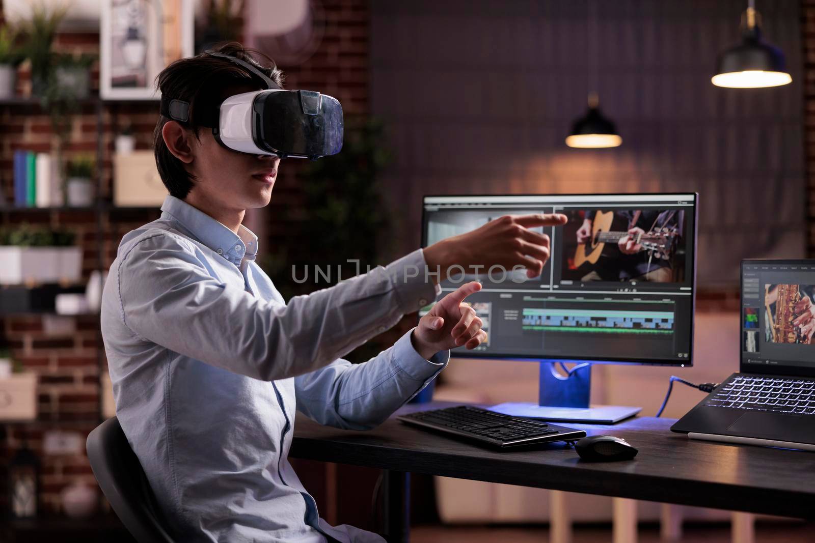 Male videographer editing movie montage with virtual reality glasses, using multimedia production software to create footage. Edit with color grading and visual effects, working with vr goggles.