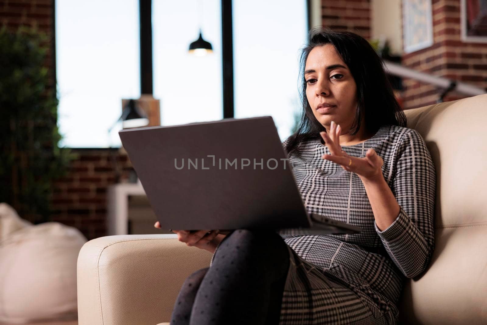 Indian woman talking on online teleconference by DCStudio