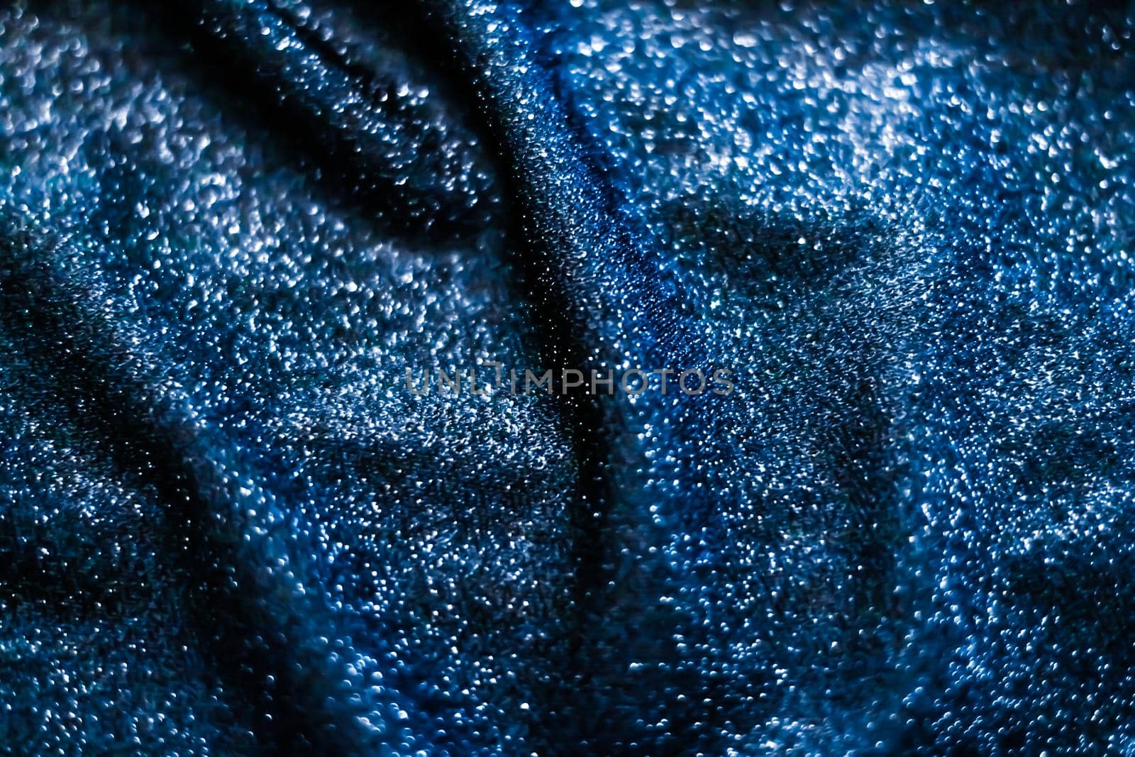 Blue holiday sparkling glitter abstract background, luxury shiny fabric material for glamour design and festive invitation by Anneleven