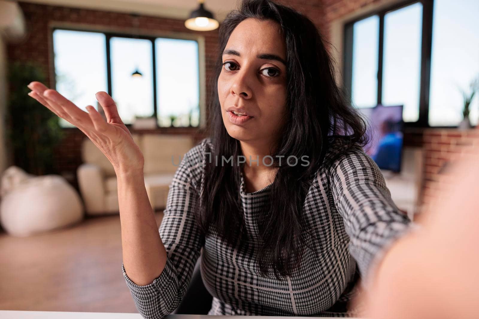 POV of business woman using conference call by DCStudio